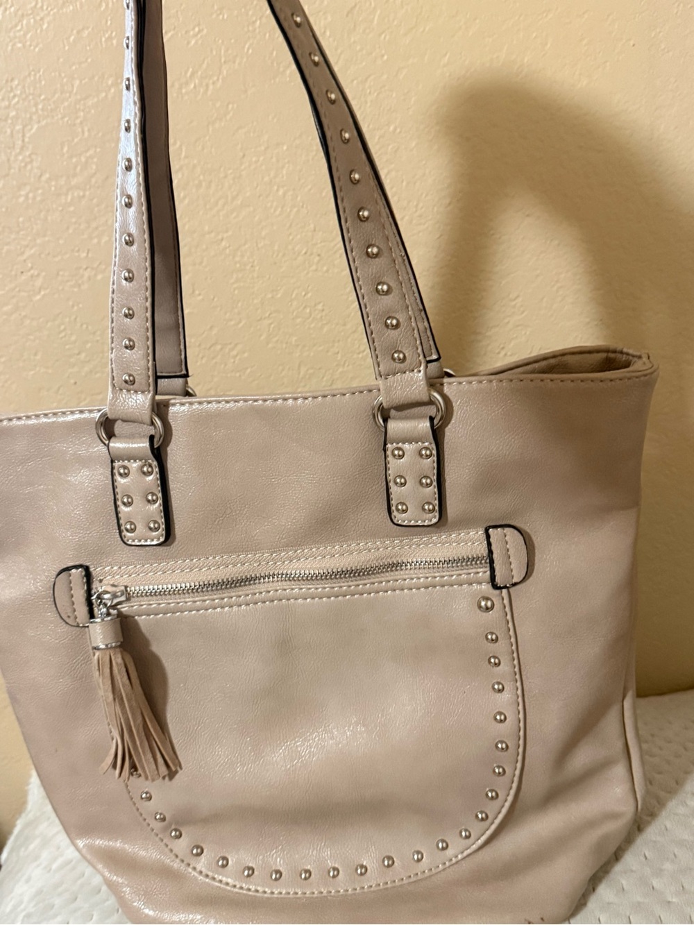 Stud-Trim Beige Tote Bag with Tassel Accent